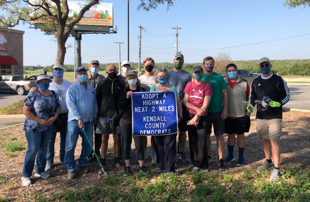 Group photo with the "Adopt-a-Highway" sign